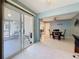 Bright Florida Room featuring tile floors and sliding glass door access to the lanai at 1102 Cara Dr, Largo, FL 33771