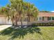 Charming single-story home featuring well-maintained landscaping and attractive stone accents at 1102 Cara Dr, Largo, FL 33771