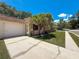 Charming single-story home featuring attached garage, well-maintained landscaping, and stone accents at 1102 Cara Dr, Largo, FL 33771