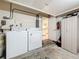 A laundry room includes a washer and dryer providing ultimate convenience at 1102 Cara Dr, Largo, FL 33771