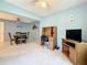 Open-concept living space with dining area and room for work/entertainment at 1102 Cara Dr, Largo, FL 33771