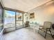 Enclosed patio with table and chairs providing a nice outdoor dining space at 1102 Cara Dr, Largo, FL 33771