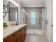 Bright bathroom with a walk-in shower, dual shower heads and vanity at 115 W Hiawatha St, Tampa, FL 33604
