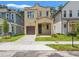 Inviting home featuring a well-manicured lawn, covered porch, and a charming two-story design with a private garage at 115 W Hiawatha St, Tampa, FL 33604