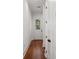 Hallway leads to backyard access door and access to upper floors at 115 W Hiawatha St, Tampa, FL 33604