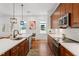 The kitchen features an oversized island with quartz countertops, stainless appliances, and ample cabinet space at 115 W Hiawatha St, Tampa, FL 33604