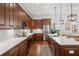 Spacious open floorplan kitchen with custom cabinets, stainless appliances, and eat-in kitchen island at 115 W Hiawatha St, Tampa, FL 33604