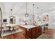 Spacious open floorplan with oversized eat-in kitchen island, stainless appliances, and open to living area at 115 W Hiawatha St, Tampa, FL 33604