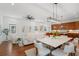 Spacious open-concept living area with hardwood floors and a seamless transition to the kitchen and dining area at 115 W Hiawatha St, Tampa, FL 33604