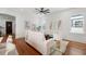 Bright living room featuring hardwood floors, large windows, and comfortable seating at 115 W Hiawatha St, Tampa, FL 33604