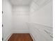 Spacious walk-in closet with wire shelving and beautiful wood floor at 115 W Hiawatha St, Tampa, FL 33604