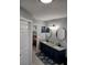 Well-lit bathroom featuring dual sinks, granite counters, and modern fixtures at 1185 Rio De Janeiro Ave, Punta Gorda, FL 33983