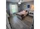 Cozy bedroom with a single bed, ceiling fan, and bright window, offering a relaxing retreat at 1185 Rio De Janeiro Ave, Punta Gorda, FL 33983