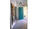 Charming foyer with decorative paddle art and a teal-colored door, creating a coastal vibe at 1185 Rio De Janeiro Ave, Punta Gorda, FL 33983