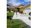 Charming single-story home features a pristine walkway and lush landscaping, enhancing its curb appeal at 1185 Rio De Janeiro Ave, Punta Gorda, FL 33983
