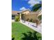 Inviting single-story home with a meticulously maintained lawn, showcasing mature landscaping and a welcoming entrance at 1185 Rio De Janeiro Ave, Punta Gorda, FL 33983