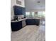 Open-concept kitchen with sleek dark blue cabinets, modern appliances, and a spacious countertop area at 1185 Rio De Janeiro Ave, Punta Gorda, FL 33983