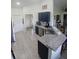 Spacious open kitchen with stainless steel appliances, granite countertops, and stylish blue cabinetry at 1185 Rio De Janeiro Ave, Punta Gorda, FL 33983