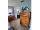 Main bedroom with views to ensuite, wooden dresser and nautical decor at 1185 Rio De Janeiro Ave, Punta Gorda, FL 33983