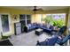 Relaxing patio with ceiling fan, outdoor furniture, and plenty of sunlight at 1185 Rio De Janeiro Ave, Punta Gorda, FL 33983