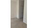 Bright bedroom features neutral carpeting, fresh paint, and a double door closet at 12749 Aston Creek Dr, Tampa, FL 33626