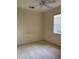 Neutral-toned bedroom featuring a ceiling fan and a window for natural light at 12749 Aston Creek Dr, Tampa, FL 33626