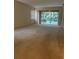 Spacious living room with carpet and sliding glass doors to lanai at 12749 Aston Creek Dr, Tampa, FL 33626