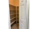 Walk-in pantry with plenty of shelving for organized storage in the home at 12749 Aston Creek Dr, Tampa, FL 33626