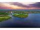 Gorgeous aerial view of waterfront neighborhood along river at sunset at 13045 Irwin Dr, Port Charlotte, FL 33953