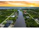 Beautiful aerial shot of waterfront homes located along tranquil canal at 13045 Irwin Dr, Port Charlotte, FL 33953