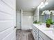 Bathroom boasting a double sink vanity and a shower-tub combo at 13045 Irwin Dr, Port Charlotte, FL 33953