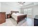 Comfortable bedroom with a ceiling fan, large bed, and warm-toned wooden furniture for a cozy feel at 13045 Irwin Dr, Port Charlotte, FL 33953