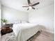 Well-lit bedroom boasts a ceiling fan and a cozy bed at 13045 Irwin Dr, Port Charlotte, FL 33953