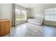Bright bedroom with neutral colors, large windows, and laminate flooring at 13045 Irwin Dr, Port Charlotte, FL 33953