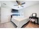 Cozy bedroom featuring a modern ceiling fan, artwork, and a stylish vanity at 13045 Irwin Dr, Port Charlotte, FL 33953