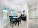 Breakfast nook featuring an elegant light fixture, lake view and stylish decor at 13045 Irwin Dr, Port Charlotte, FL 33953