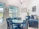 Cozy dining area featuring a glass table, seating for four, and a small coffee and beverage station at 13045 Irwin Dr, Port Charlotte, FL 33953