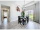 Dining area featuring a modern chandelier, a large window and decor at 13045 Irwin Dr, Port Charlotte, FL 33953