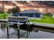 Waterfront home features a private boat dock on the canal with quick access to the Gulf at 13045 Irwin Dr, Port Charlotte, FL 33953