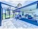 Enclosed lanai with outdoor kitchen and swing seating area, perfect for entertaining at 13045 Irwin Dr, Port Charlotte, FL 33953