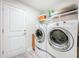 Functional laundry room equipped with a washer and dryer at 13045 Irwin Dr, Port Charlotte, FL 33953