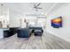 Spacious living room with modern furnishings, tray ceiling, and ample natural light at 13045 Irwin Dr, Port Charlotte, FL 33953