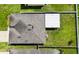 Overhead view of home, highlighting the roof, screen patio, air conditioning, and privacy fence at 14524 Dunrobin Dr, Wimauma, FL 33598