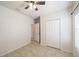 Bright bedroom featuring tiled flooring, a ceiling fan, and plenty of natural light at 14524 Dunrobin Dr, Wimauma, FL 33598