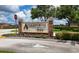Ayersworth Park entrance sign set among lush landscaping creates a welcoming community at 14524 Dunrobin Dr, Wimauma, FL 33598