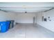 Spacious two car garage with clean floors and ample room for storage at 14524 Dunrobin Dr, Wimauma, FL 33598