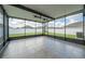 Screened-in lanai with tile flooring, offering an ideal outdoor living space at 14524 Dunrobin Dr, Wimauma, FL 33598