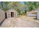 The backyard shows a shed with open doors, with a fenced perimeter at 1520 S Michigan Ave, Clearwater, FL 33756