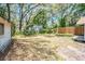 An overview of the backyard with a shed and partial wooden fence at 1520 S Michigan Ave, Clearwater, FL 33756