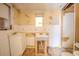 Bathroom featuring dated fixtures, sink, toilet, a small window, and significant disrepair at 1520 S Michigan Ave, Clearwater, FL 33756